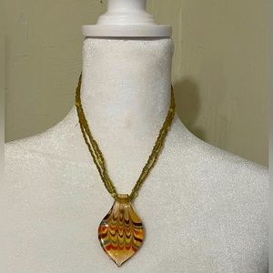 Golden yellow small bead multi strand necklace and glass teardrop ribboned